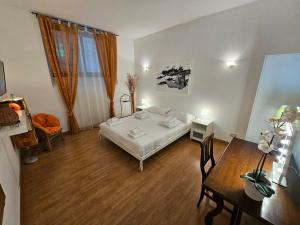 a bedroom with a bed and a table and a dining room at Private SPA Apartment in Rome in Rome
