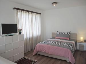 Ένα ή περισσότερα κρεβάτια σε δωμάτιο στο Attico Luciana by Fewotessin