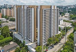 an aerial view of a city with tall buildings at Tropical apartament in São Paulo