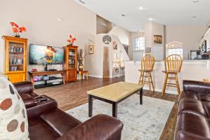 a living room with a couch and a table at Family Villa Destination in Davenport
