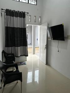 TV a/nebo společenská místnost v ubytování Alceo Homestay Family