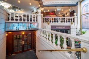 a staircase in a bar with a stair case at Sachas Hotel Manchester in Manchester