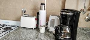 a kitchen counter with a blender and a toaster at Monoambiente M y L in La Plata