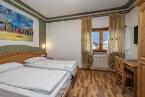 Postel nebo postele na pokoji v ubytování Hotel Franco