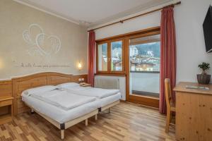 Postel nebo postele na pokoji v ubytování Hotel Franco
