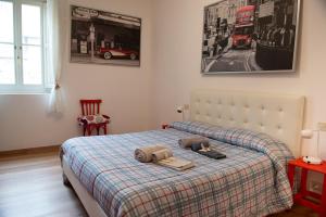 a bedroom with a bed with two pillows on it at Historic center Teatro Regio appartamento Luca in Parma
