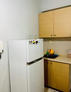 O bucătărie sau chicinetă la Cozy apartment 3