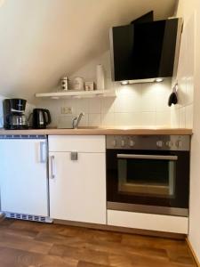 Η κουζίνα ή μικρή κουζίνα στο Meerzeit in Schönhagen