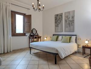 a bedroom with a bed and a window at Agriturismo Mammarella in Altavilla Silentina +69 photos