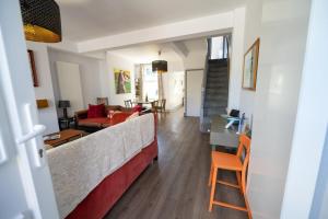 a living room with a couch and a table at Family friendly, sleeps 5, 3 mins to beach in Deal