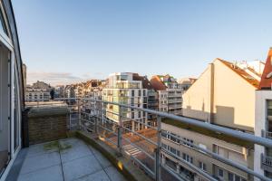 a view of a city from a balcony at Stijlvol & lichtrijk Penthouse app met parking in Knokke-Heist