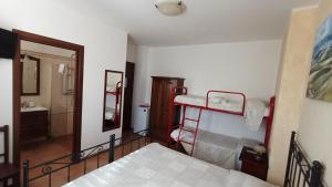 A bed or beds in a room at B&B Itufi