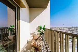 a balcony with a view of an airport at 017 - Mag 900 in Umm Al Quwain