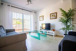 Telewizja i/lub zestaw kina domowego w obiekcie Villa Cañada torremolinos