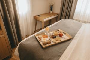 Кровать или кровати в номере GIARDINO High living suites
