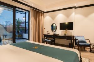 TV a/nebo společenská místnost v ubytování Hanoi Bliss Hotel
