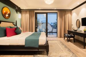 Postel nebo postele na pokoji v ubytování Hanoi Bliss Hotel + 37 fotografií