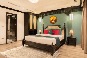 Postel nebo postele na pokoji v ubytování Hanoi Bliss Hotel