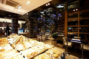 a bakery with a lot of food on display at HiSeoul Youthhostel in Seoul