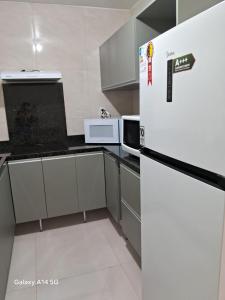 Dapur atau dapur kecil di Apto bem localizado e tranquilo no centro