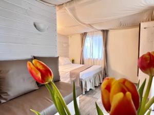 Postel nebo postele na pokoji v ubytování Camping Campo dei Fiori