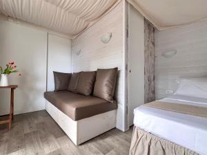 Postel nebo postele na pokoji v ubytování Camping Campo dei Fiori
