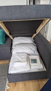 a small bed with some pillows and a bed frame at Seaside Chalet Retreat in Sidmouth in Sidmouth +2 photos