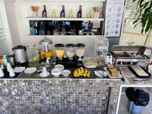 Kuchyň nebo kuchyňský kout v ubytování City Caribbean Hotel Boutique