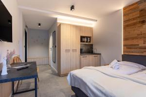 Postel nebo postele na pokoji v ubytování Apart-Invest Gimnazjalna 6