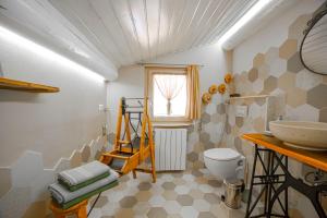 a bathroom with a sink and a toilet at B&B Botton d'Oro Valle Imagna in Fuipiano Valle Imagna +119 photos