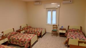 Postel nebo postele na pokoji v ubytování Casa per ferie Maria Ausiliatrice