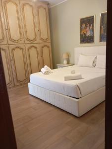 A bed or beds in a room at San Giovanni Apartment with Balcony