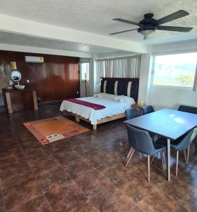 Postel nebo postele na pokoji v ubytování Hotel Leyenda del Tepozteco