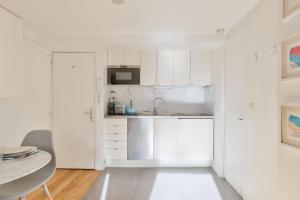 Kuchnia lub aneks kuchenny w obiekcie Bel appartement au coeur de Montorgueil