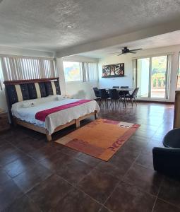 Postel nebo postele na pokoji v ubytování Hotel Leyenda del Tepozteco