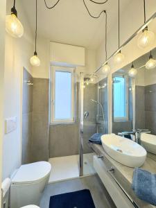 a bathroom with two sinks and a shower at Casa Biba in Finale Ligure +23 photos