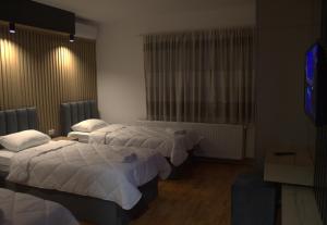 Ένα ή περισσότερα κρεβάτια σε δωμάτιο στο Hotel Cingo
