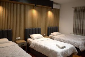 Postel nebo postele na pokoji v ubytování Hotel Cingo + 37 fotografií