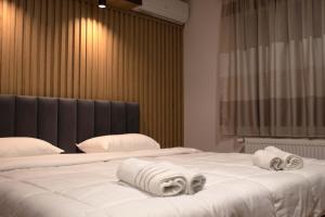 Ένα ή περισσότερα κρεβάτια σε δωμάτιο στο Hotel Cingo