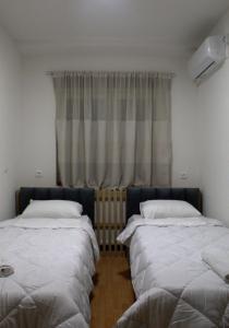 Ένα ή περισσότερα κρεβάτια σε δωμάτιο στο Hotel Cingo
