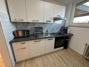 Η κουζίνα ή μικρή κουζίνα στο H&S Host & Sleep Emsdetten Groß & Ruhig