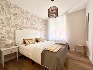 Postel nebo postele na pokoji v ubytování Housingleón San Juan Luxury Home