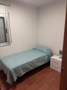 Ένα ή περισσότερα κρεβάτια σε δωμάτιο στο Delti apartamento