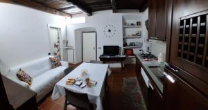 a living room with a couch and a table at Il Sasso appartamento in Orta San Giulio