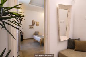 Postel nebo postele na pokoji v ubytování Palazzo San Lazzaro - Jacuzzi Rooms & Suites Lecce Selection