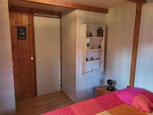 Ένα ή περισσότερα κρεβάτια σε δωμάτιο στο Chalet Cosy - U Nestru