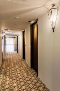 an empty hallway with a hallwayngth at Lacle Hotel-Luzhou Taipei in Taipei