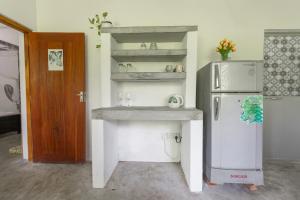 a kitchen with a sink and a refrigerator at Tiny House Talalla in Matara +23 photos