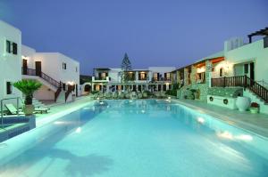 a large swimming pool in the middle of a building at Contaratos Beach Hotel in Naousa