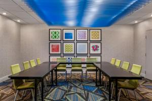 a conference room with a table and chairs at Holiday Inn Express Tallahassee by IHG in Tallahassee +42 photos